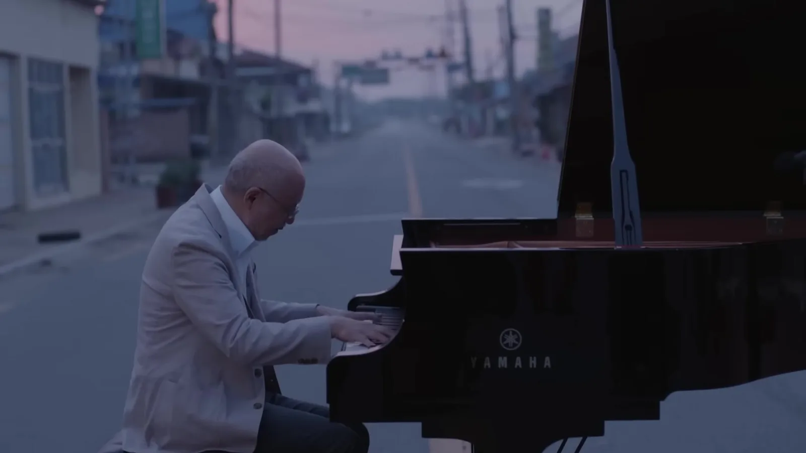 A grand piano set up on an empty village street in Juksan-myeon, Gimje at dawn